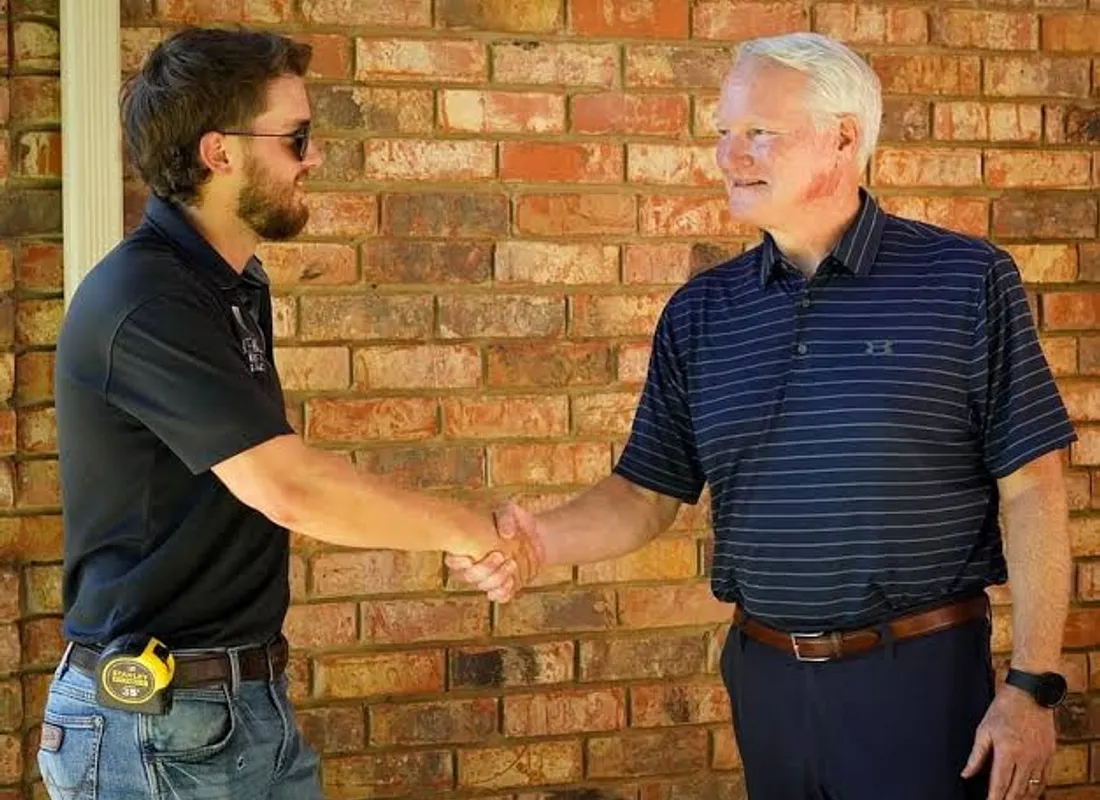 A Conners team member with a satisfied Brisbane customer